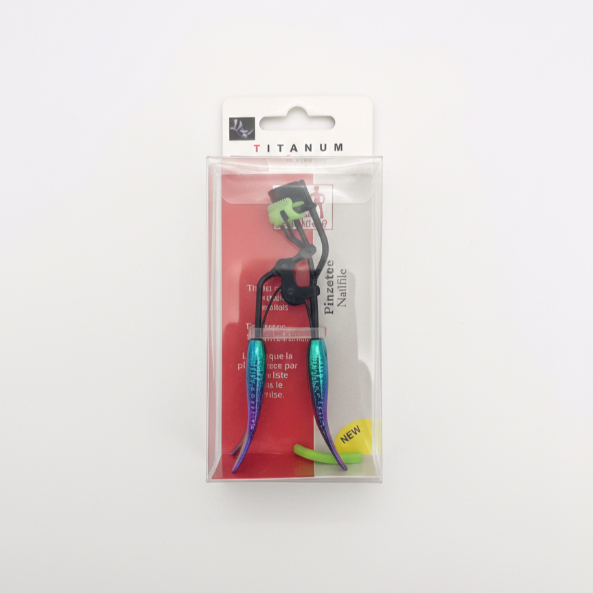 Titanum mermaid tail eyelash curler-2 Titanum Series eyelash curler with black metal frame and iridescent mermaid-style handles in a clear plastic retail display box.